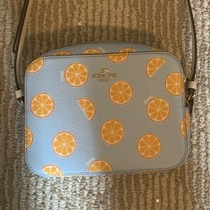 Coach purse- baby blue leather with orange slice pattern